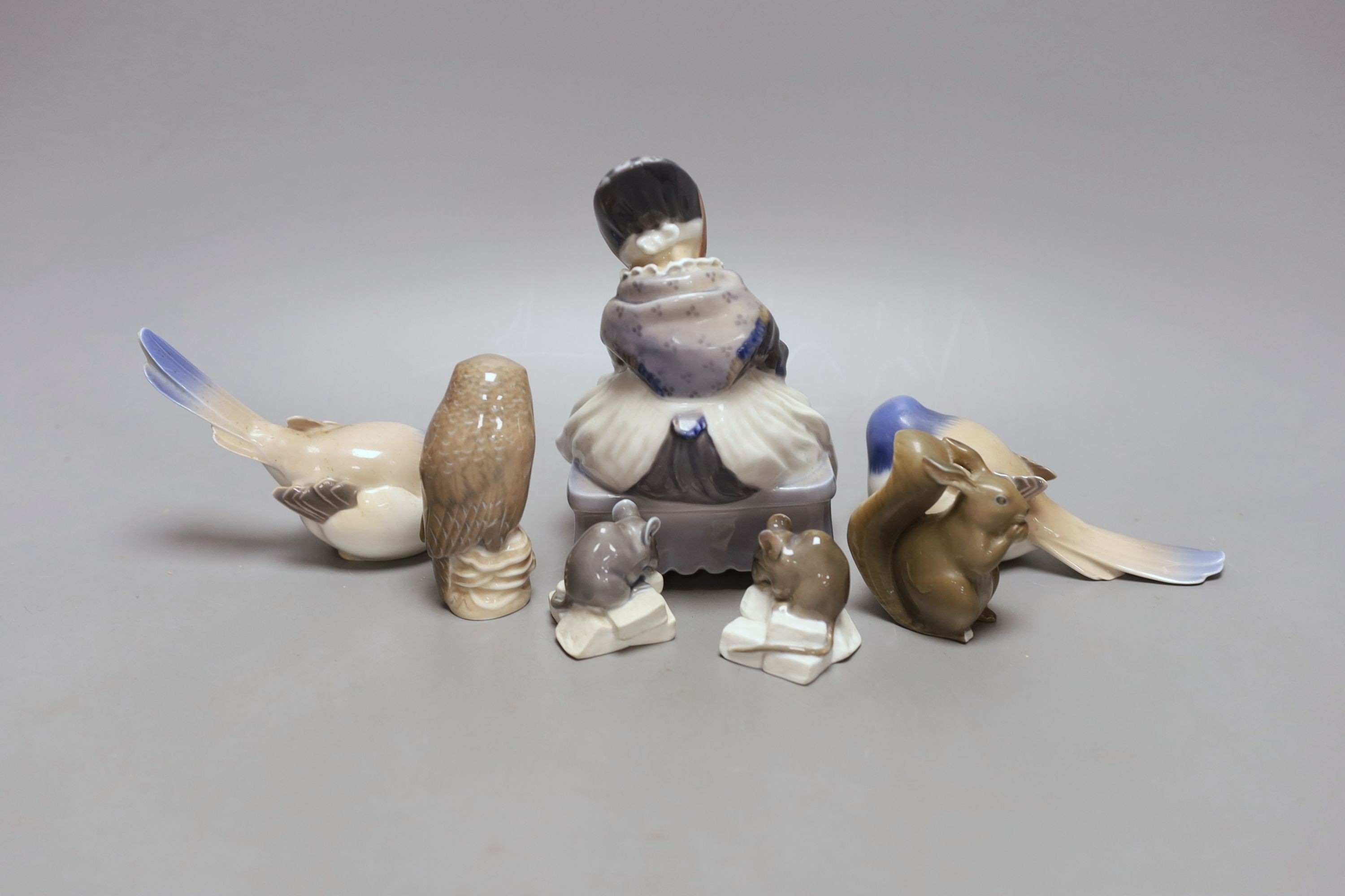 A Royal Copenhagen figure of a girl, three birds and three animals